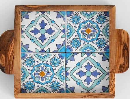 Decorative tray with wooden handles featuring a colorful tile pattern on a white background