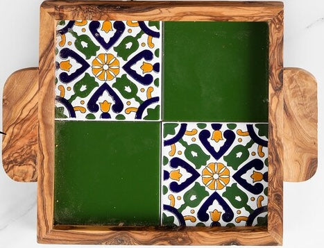 Decorative tile set with a wooden frame featuring geometric patterns.